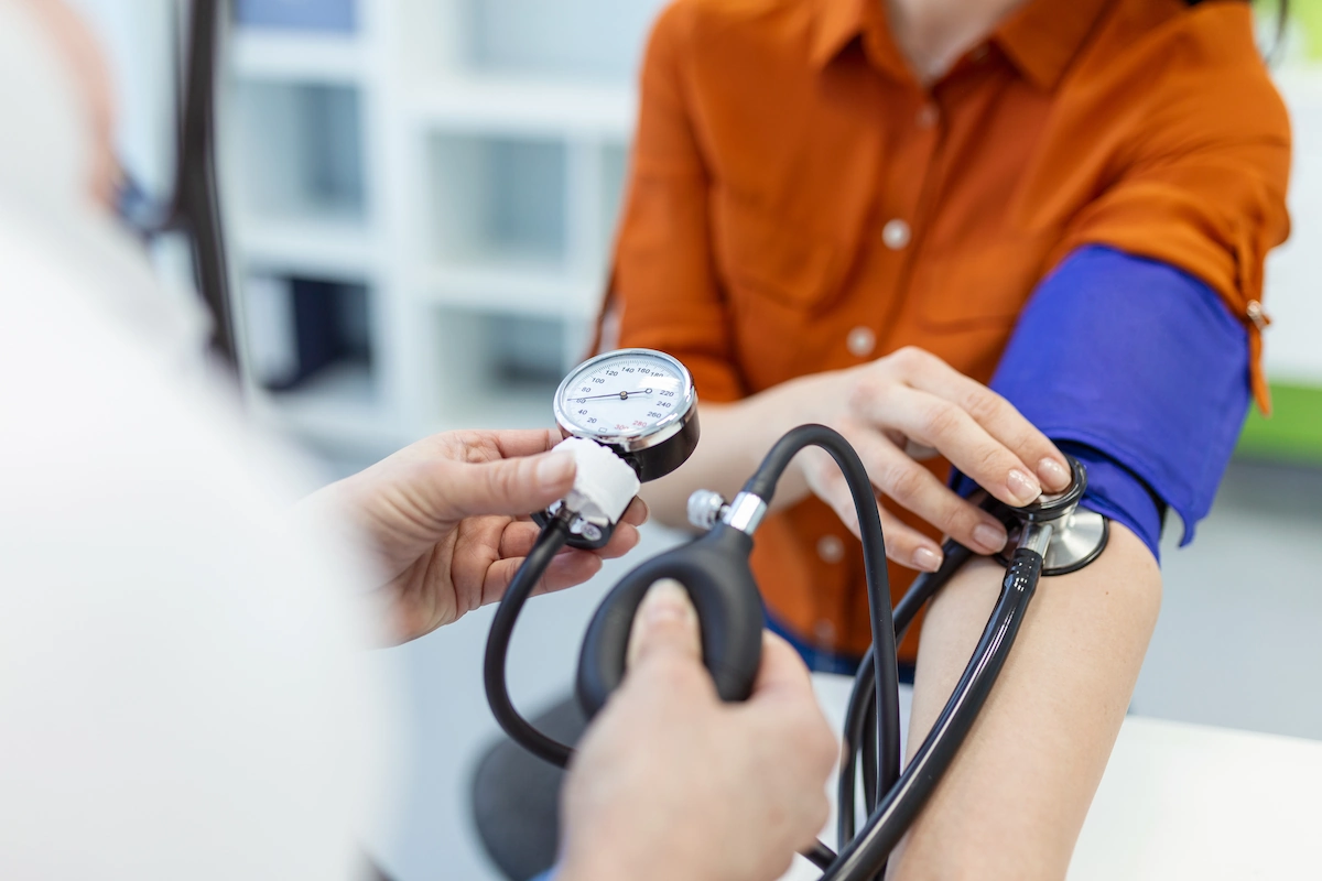 blood-pressure-test Doctor checking blood pressure of patient
